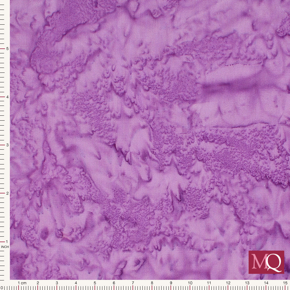 Cotton quilting fabric with salt dye effect in purple