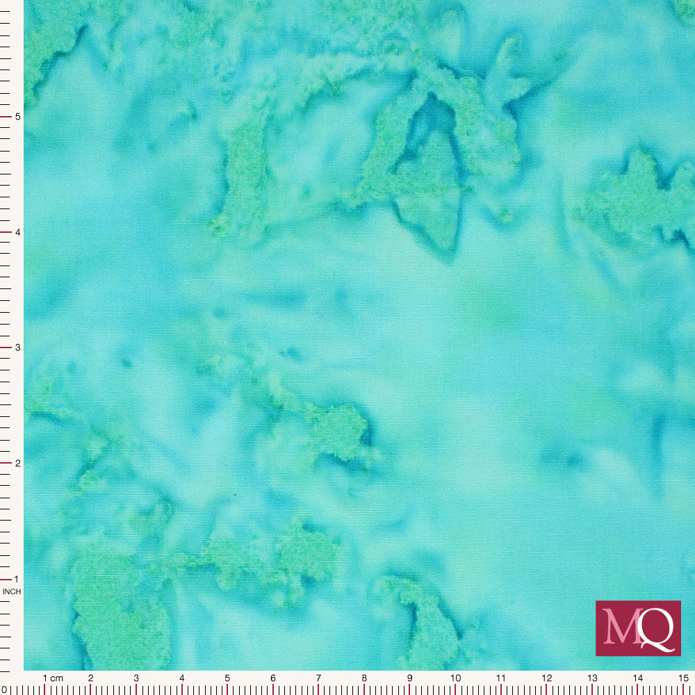 Cotton quilting fabric with salt dye effect in blue with green highlights