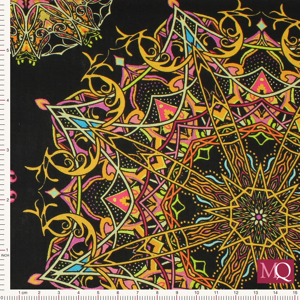 Cotton quilting fabric with kaleidoscope design in bright yellows, reds, pinks and blues on black background