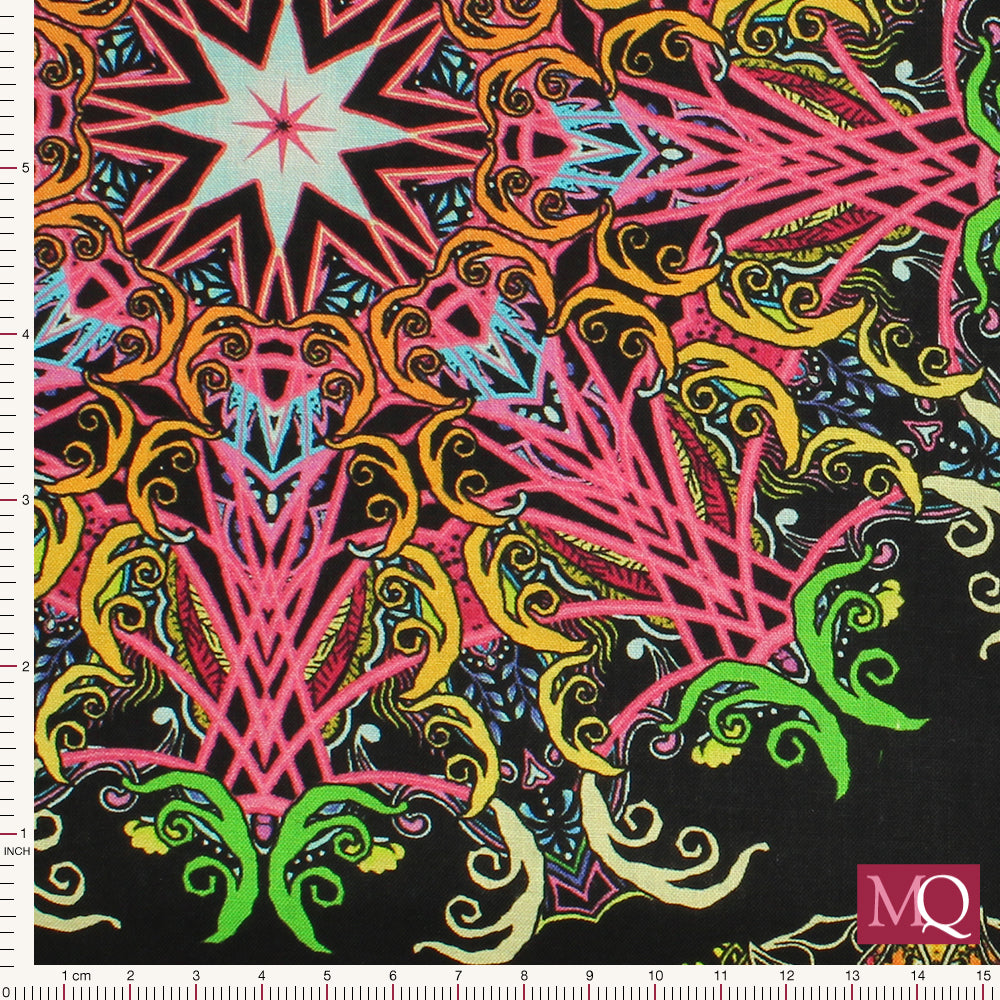 Cotton quilting fabric with kaleidoscope design in bright yellows, reds, pinks and blues on black background