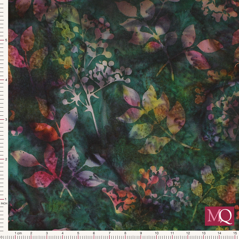 Cotton quilting fabric in batik style featuring multicolour plants on dark green background