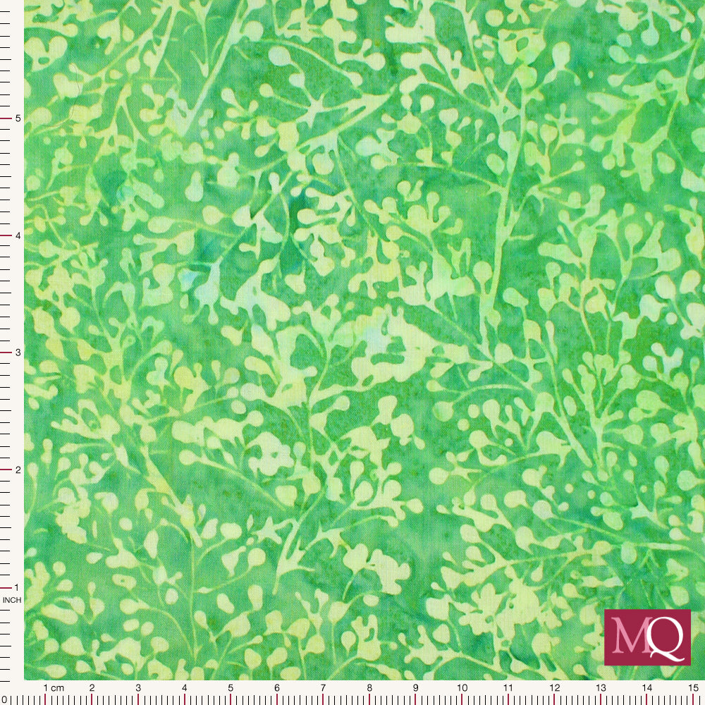 Cotton quilting fabric with tonal batik design featuring green stems on green