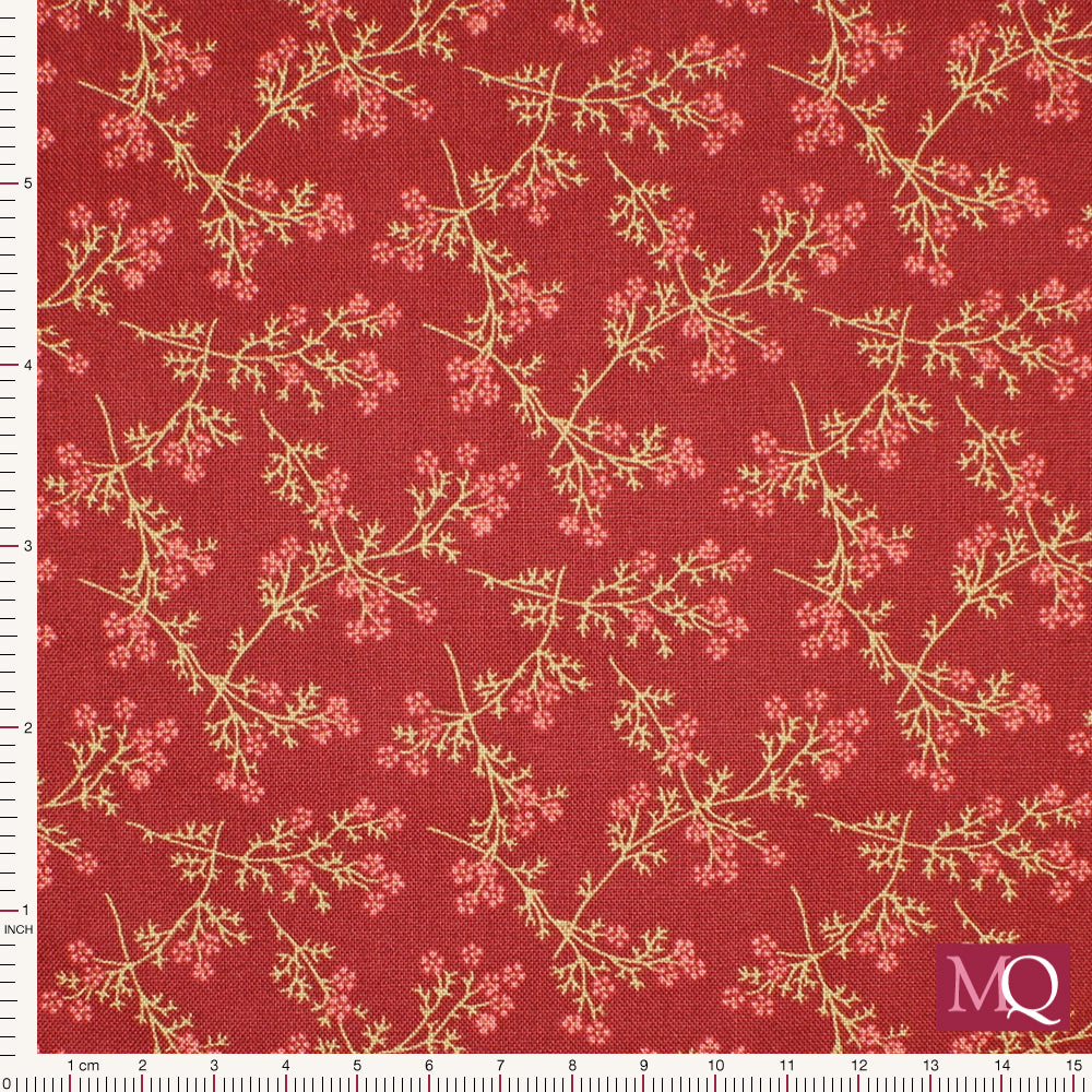 Cotton quilting fabric with delicate floral sprigs on a red background