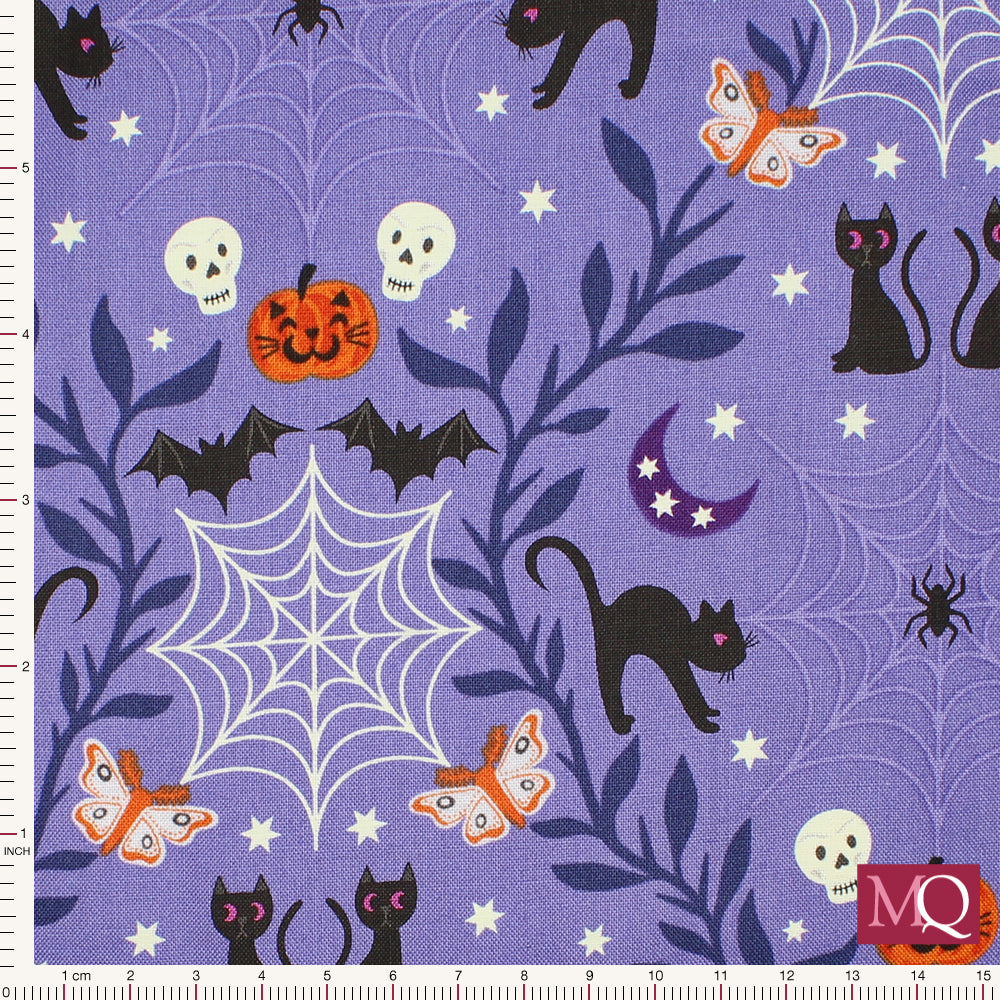 Cotton quilting fabric with halloween theme on purple background featuring cats, pumpkins, bats and spiders webs