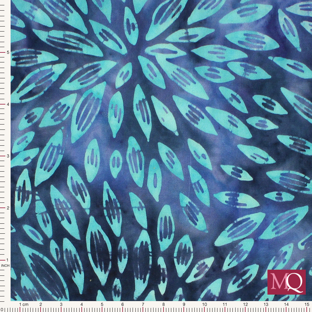 Cotton quilting fabric with tonal blue and turquoise petals in concentric circles