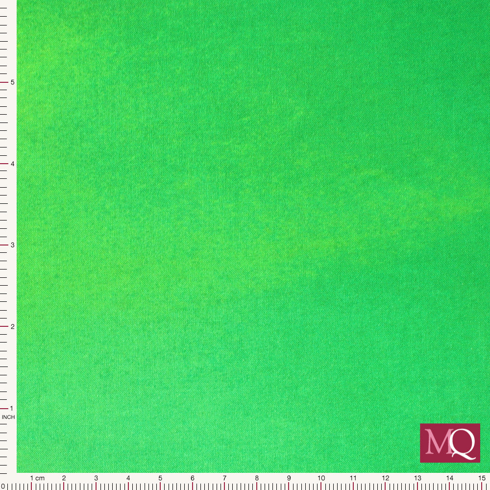 Cotton quilting fabric with painterly ombre running from lime green to deep forest green