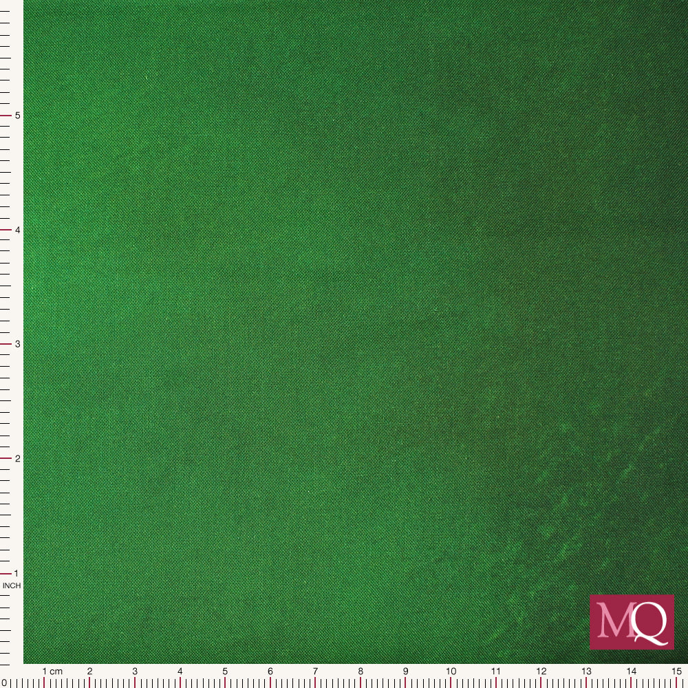 Cotton quilting fabric with painterly ombre running from lime green to deep forest green
