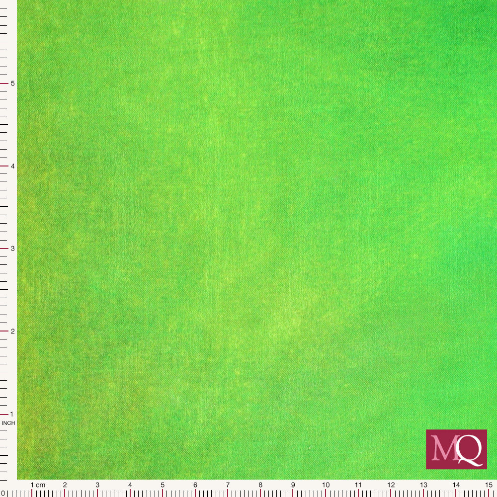 Cotton quilting fabric with painterly ombre running from lime green to deep forest green