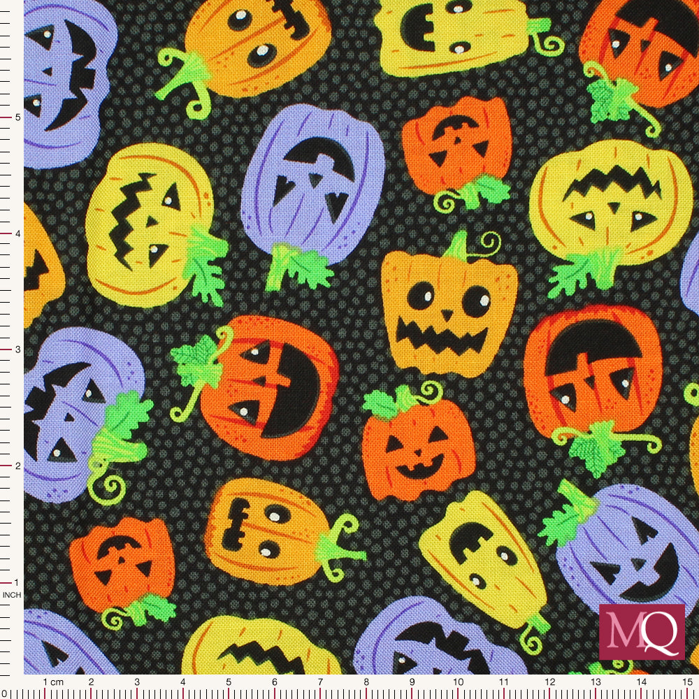 Cotton quilting fabric with novelty halloween print of pumpkins in multi colours with a range of facial expressions