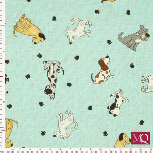 Cotton quilting fabric with novelty dog print all over on light blue