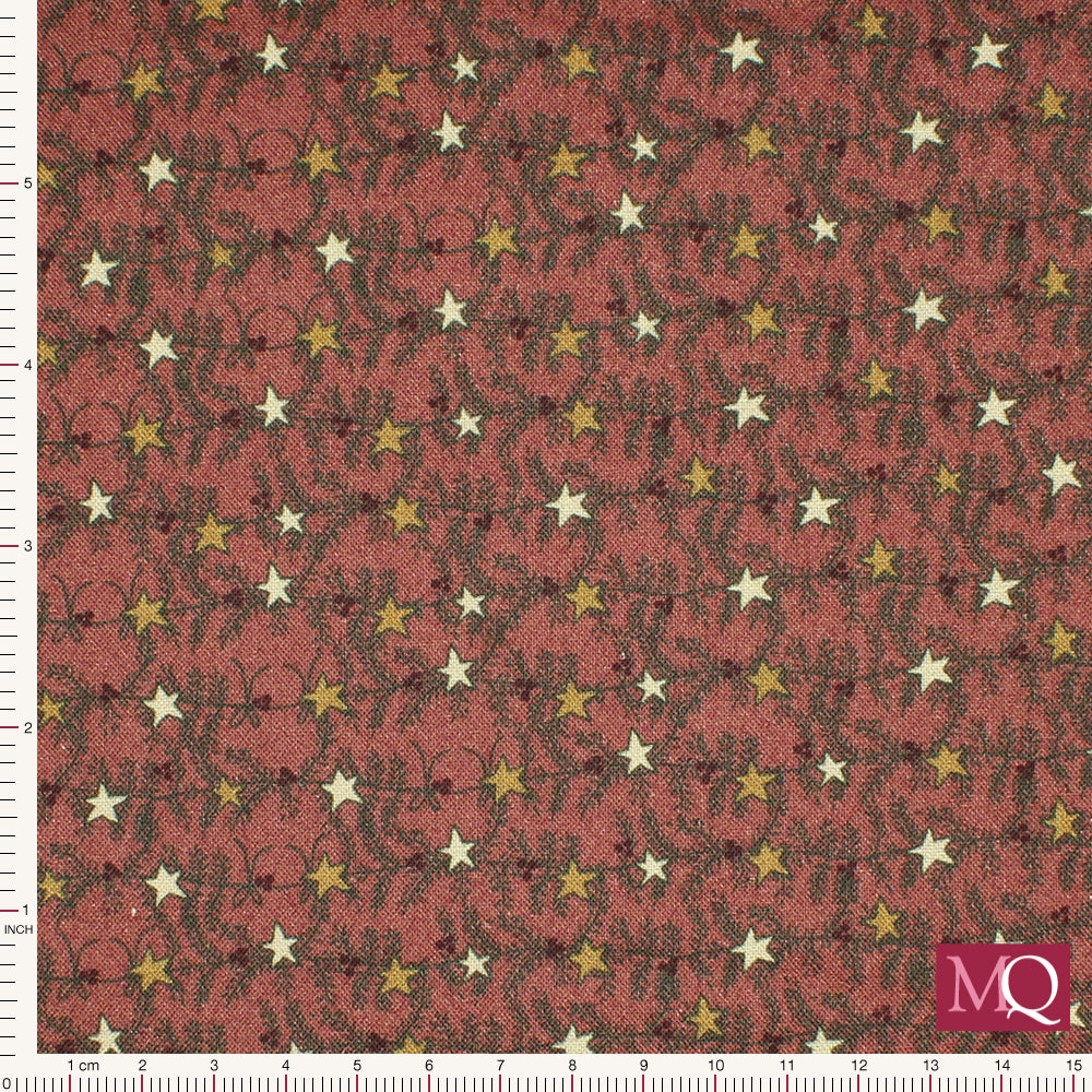 Cotton quilting fabric with modern Christmas print in traditional warm tones featuring stars