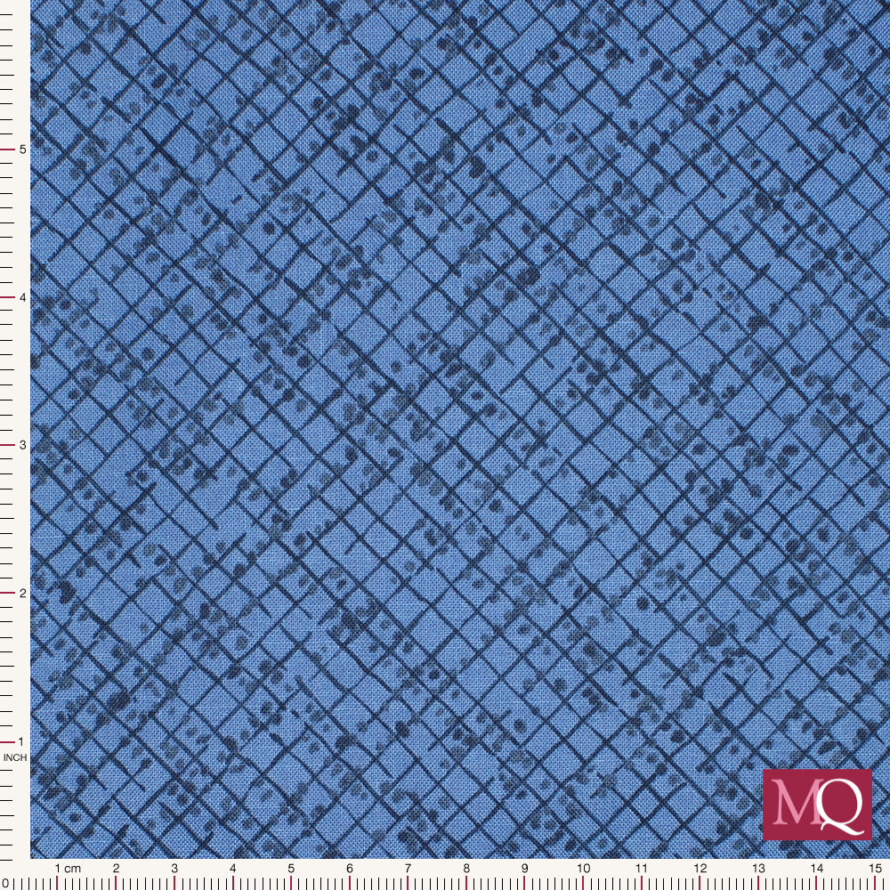 Cotton quilting fabric with painterly grid texture and dappled dots in warm blue tones