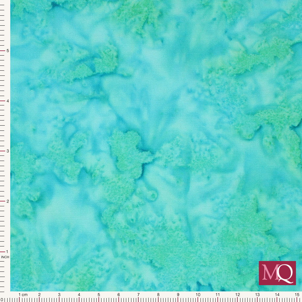 Cotton quilting fabric with salt dye effect in blue with green highlights
