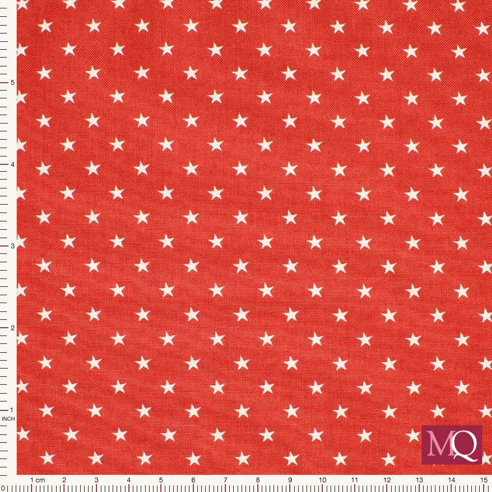 Cotton quilting fabric with tiny white stars on a red background