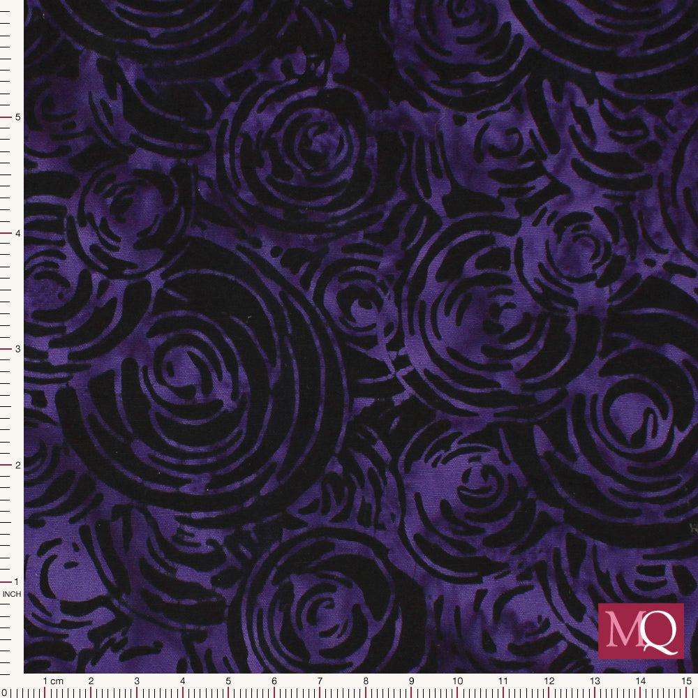 Cotton quilting fabric with abstract wax resist batik circles design in purple and black