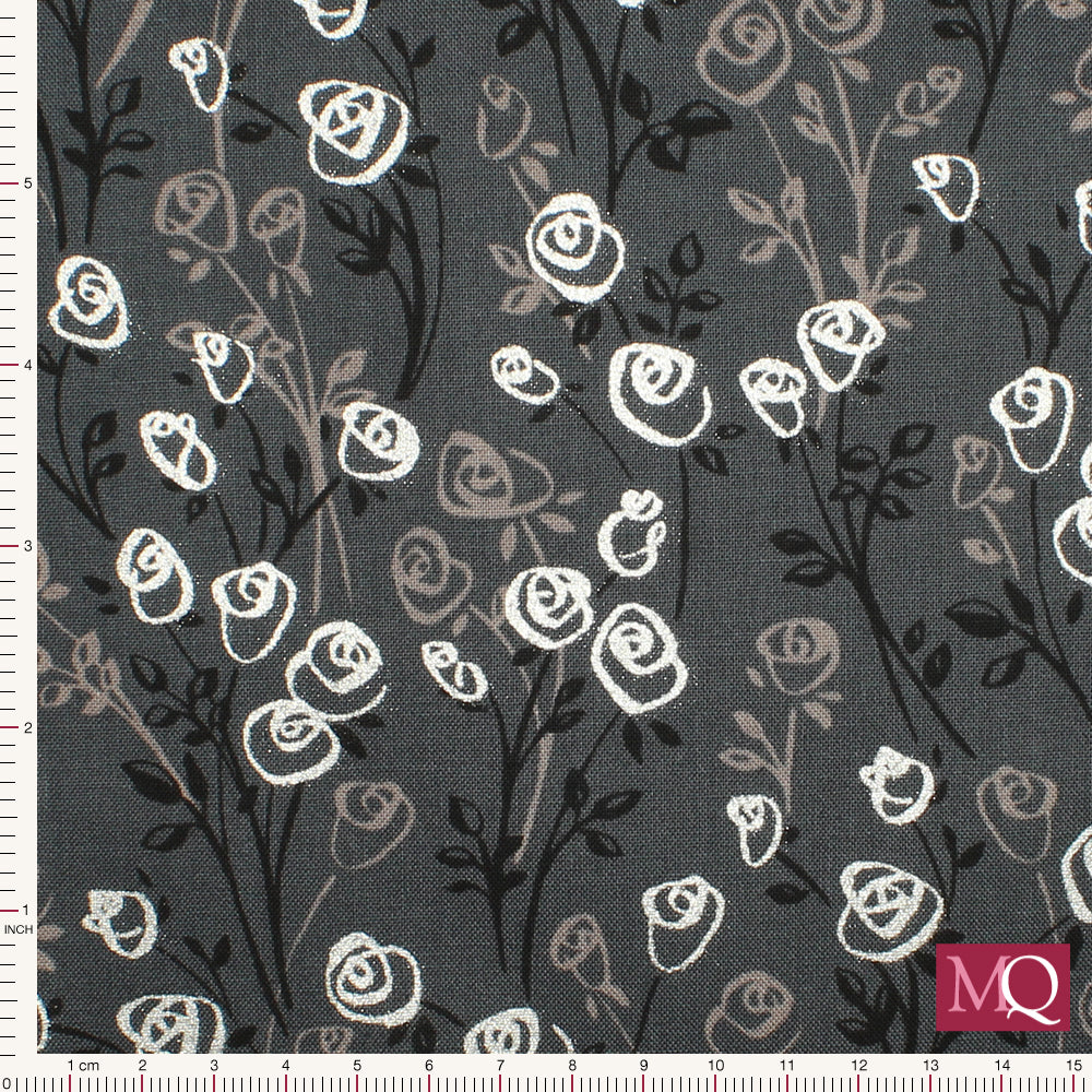Cotton quilting fabric with modern floral design on charcoal grey background with silver highlights