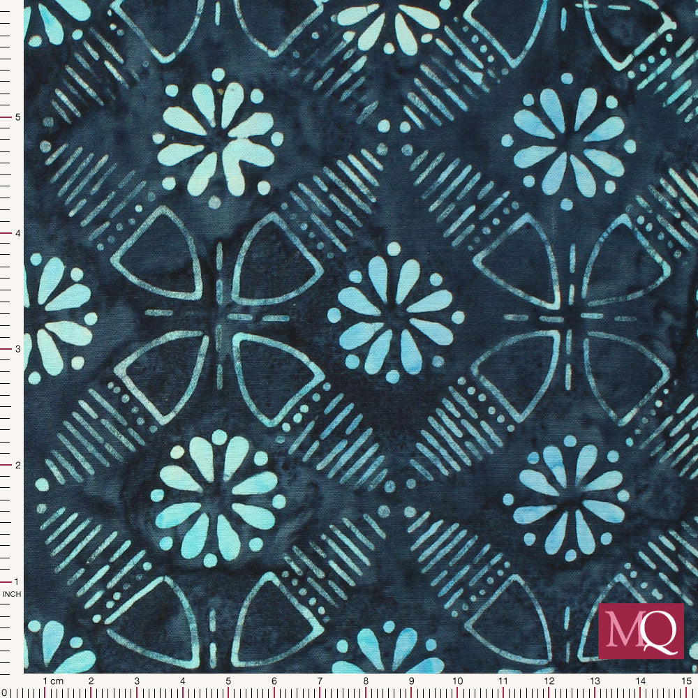 Cotton quilting fabric with high contrast batik design in geometric layout on dark blue