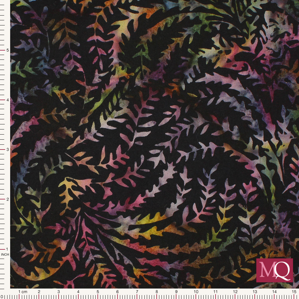 Cotton quilting fabric with multi coloured tie dye stems on a black background