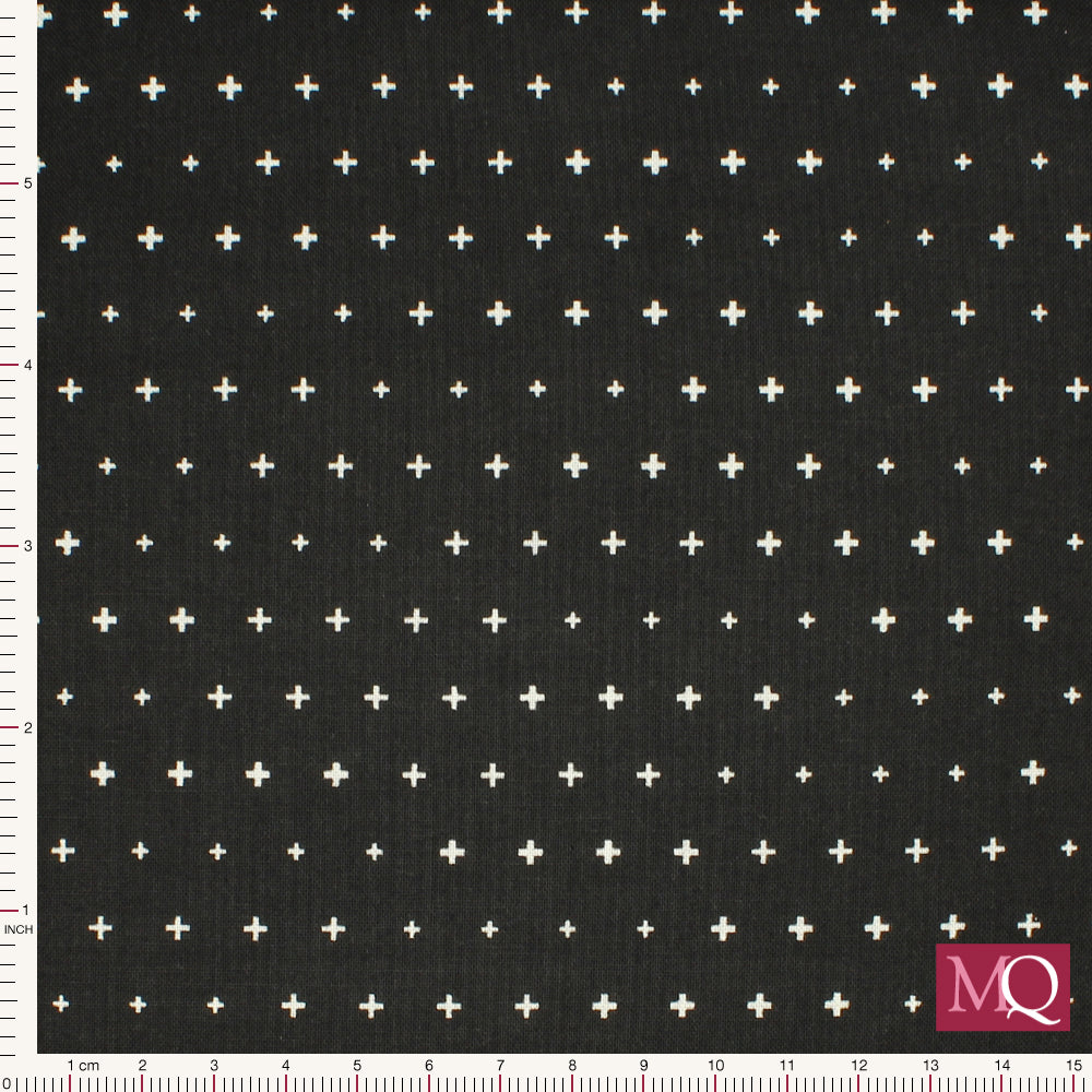 Cotton quilting fabric with tiny white crosses on black backgorund