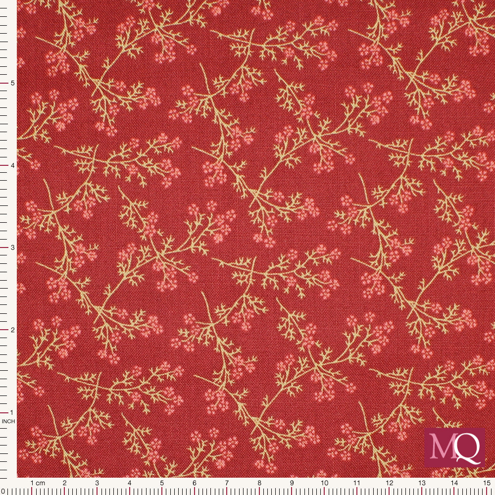 Cotton quilting fabric with delicate floral sprigs on a red background