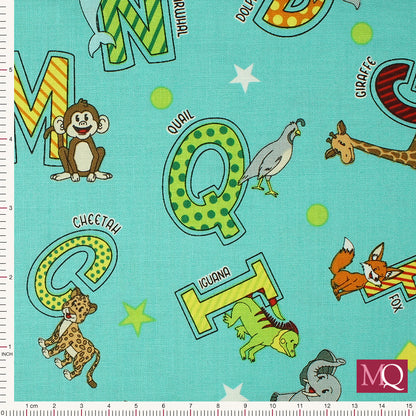 Cotton quilting fabric with alphabets and animals on turquoise