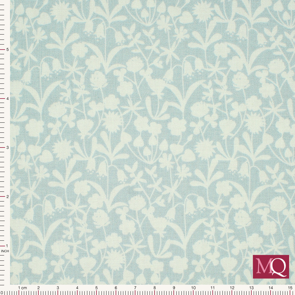 Cotton quilting fabric with pale blue flower silhouettes on a tonal muted sky blue background