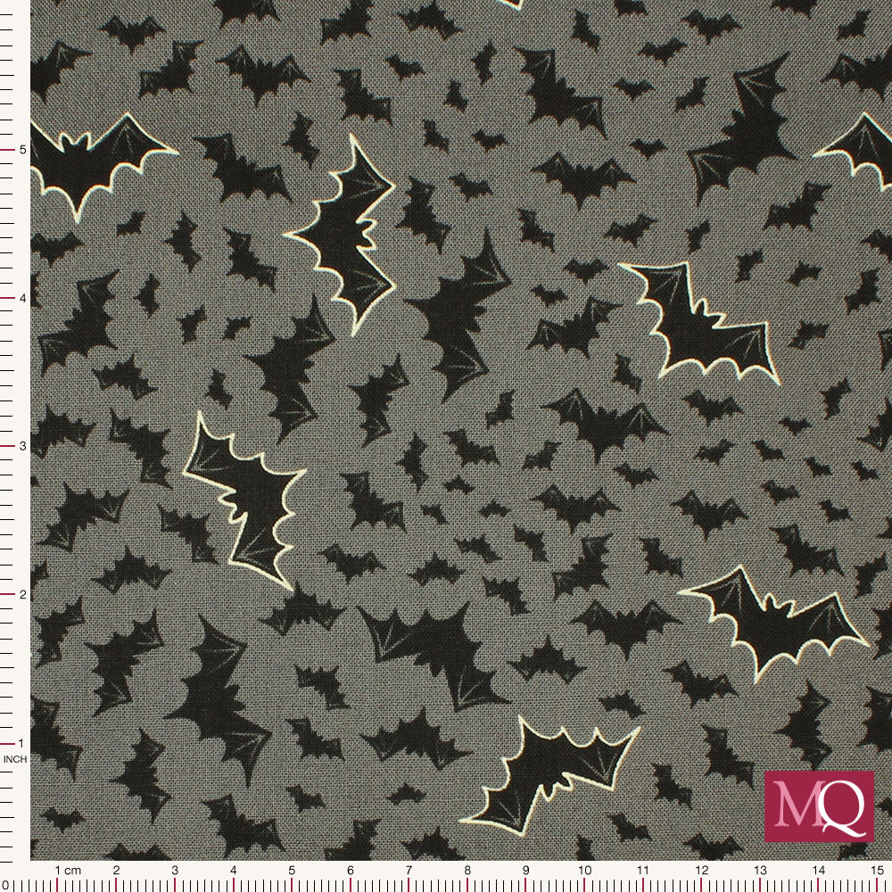 Cotton quilting fabric with modern halloween bats in black on a grey background