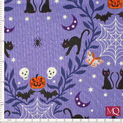 Cotton quilting fabric with halloween theme on purple background featuring cats, pumpkins, bats and spiders webs
