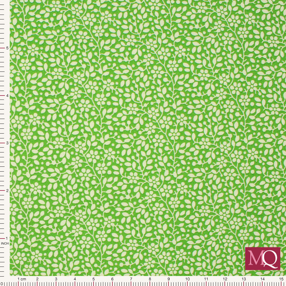 Cotton quilting fabric featuring delicate white foliage on a bright green backdrop