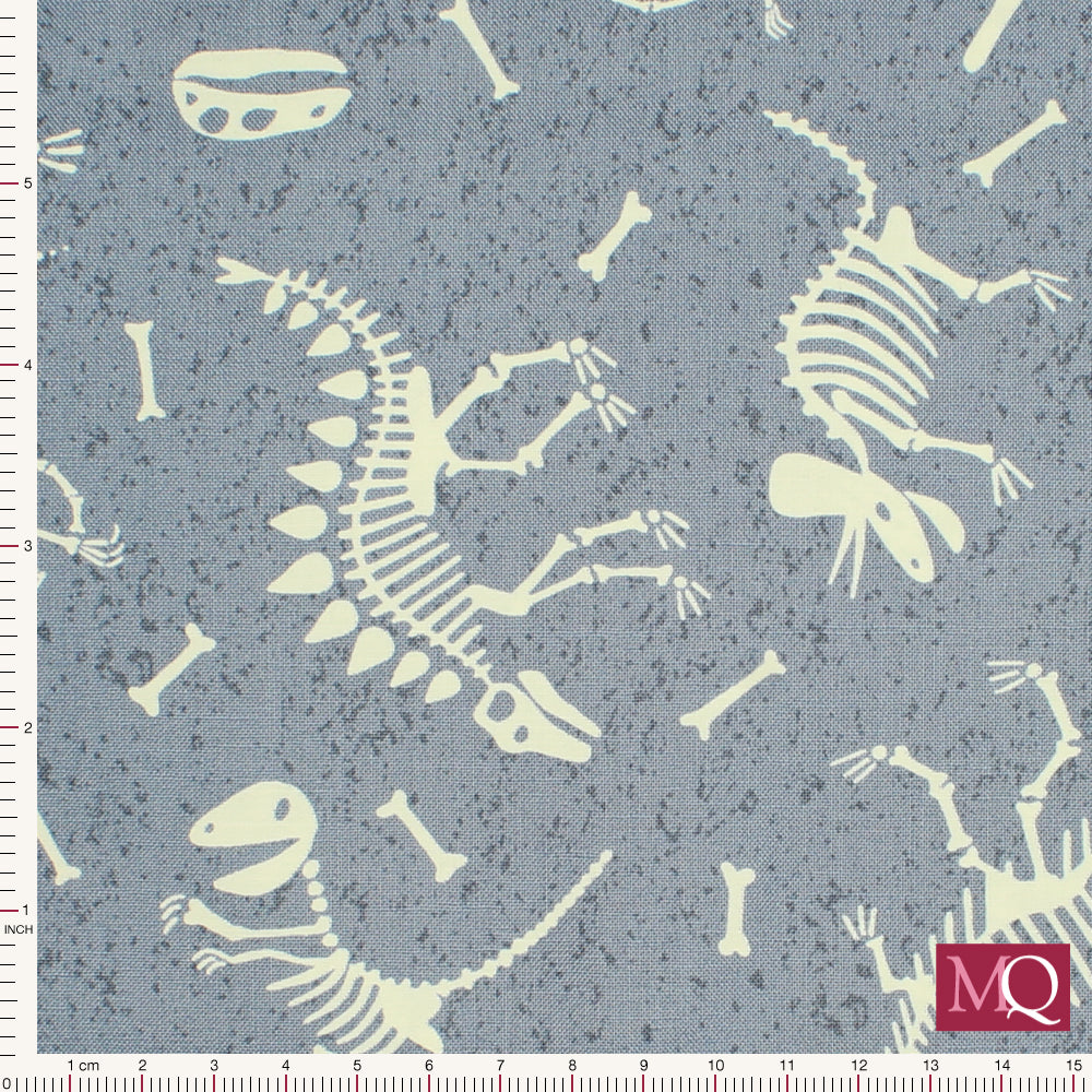 Cotton quilting fabric featuring archeological dinosaur fossils on grey background, with glow in the dark highlights