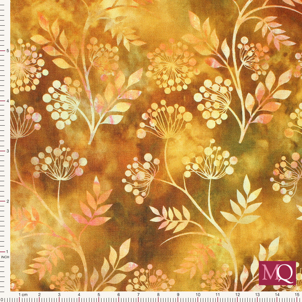 Cotton quilting fabric with batik style design of foliage on a mottled yellow background