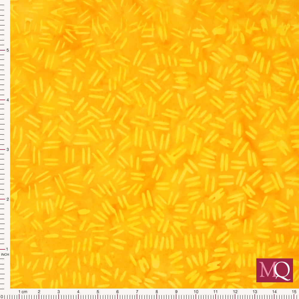Cotton quilting fabric with small tonal yellow dashes on a yellow background in a batik style