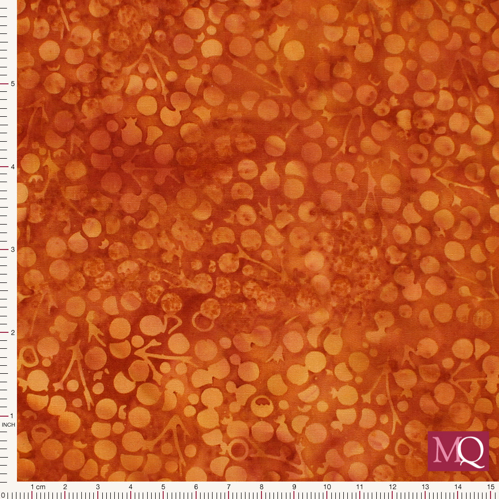 Cotton quilting fabric with tonal orange berry design in a batik style