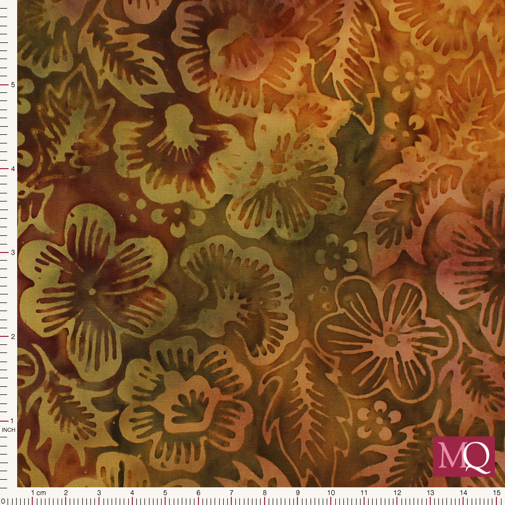 Cotton quilting fabric featuring all over batik print of mixed botanical designs on brown background