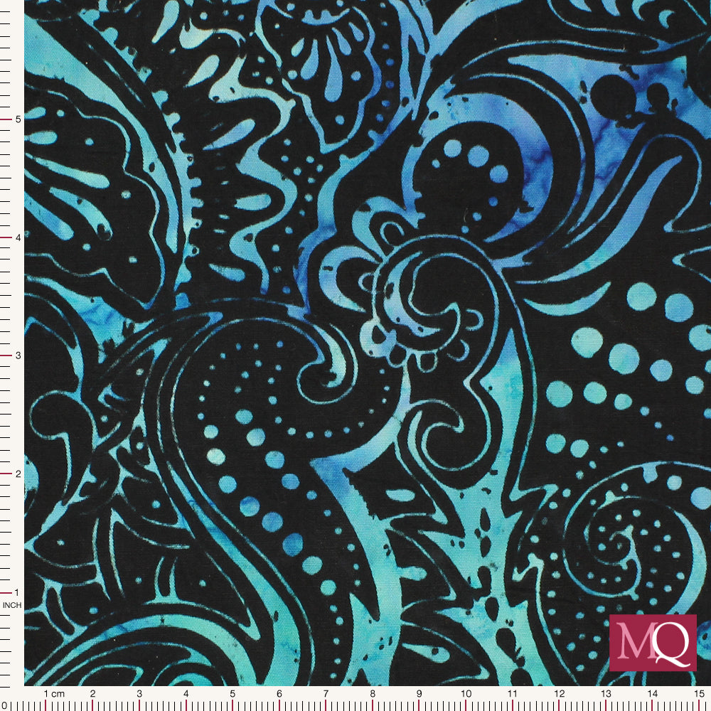 Cotton quilting fabric with high contrast batik pattern in paisley style swirls in bright blue on black