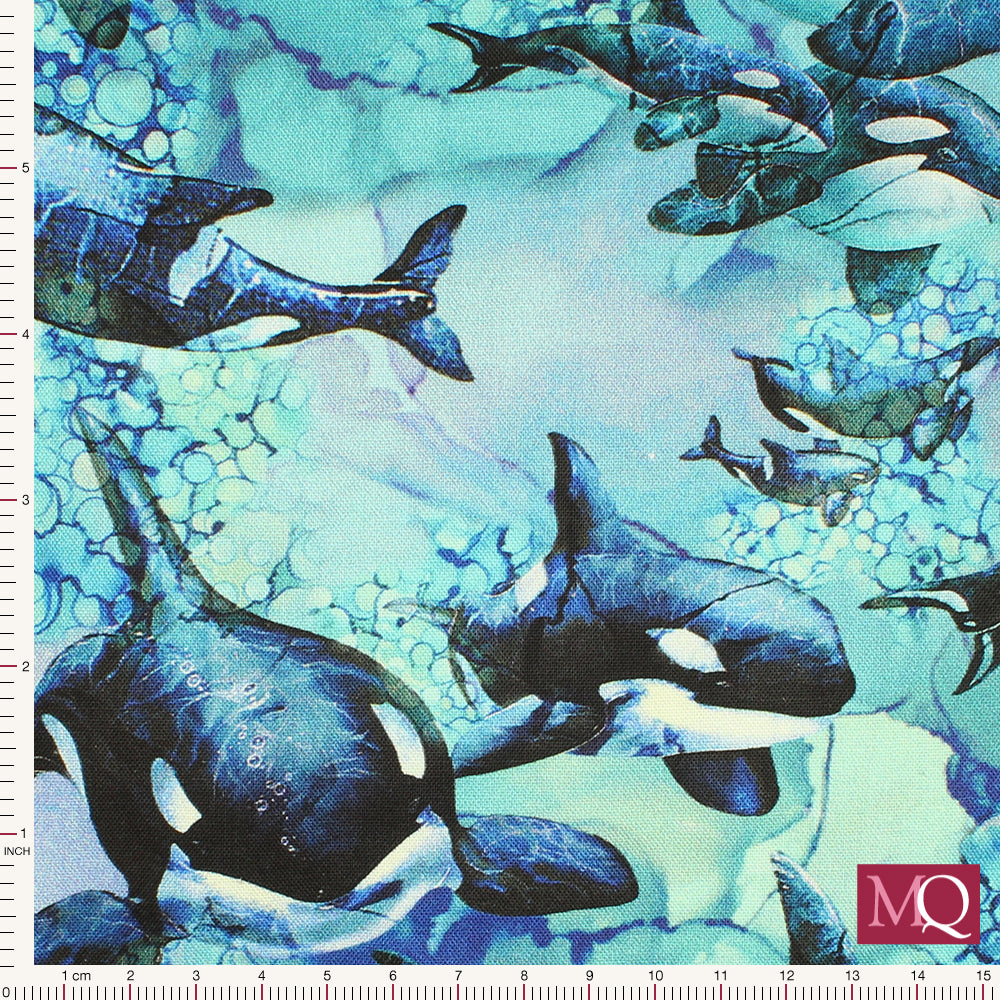 Cotton quilting fabric featuring realistic whales swimming in painterly abstract sea