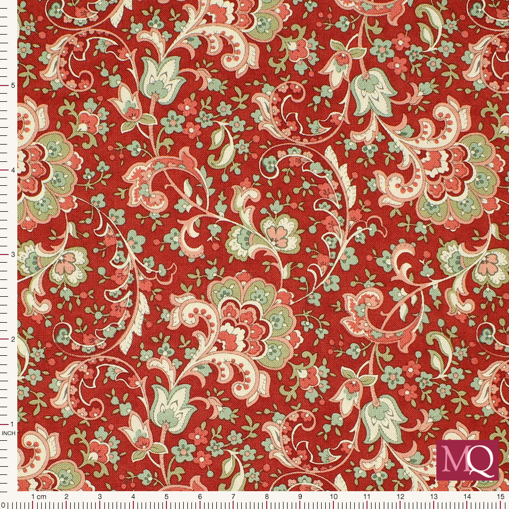 Cotton quilting fabric with floral paisley style design on red