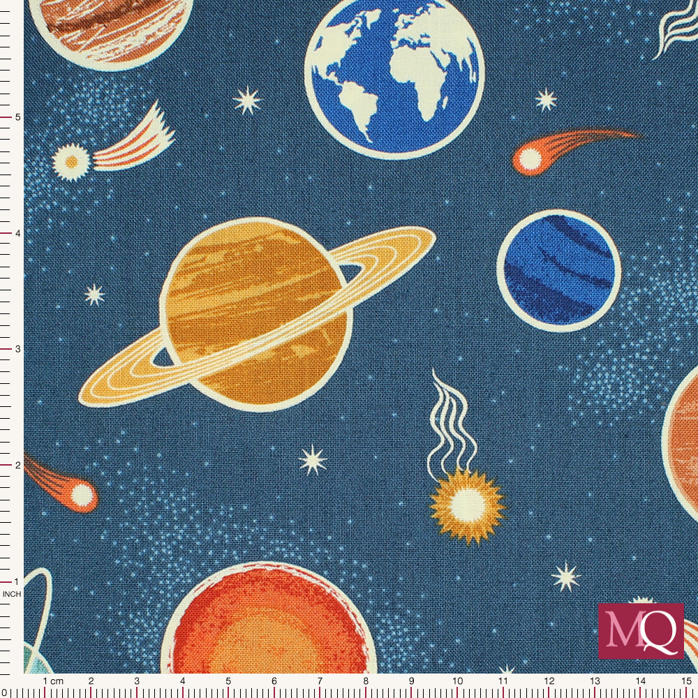 Cotton quilting fabric with modern space design featuring planets and shooting stars with glow in the dark details