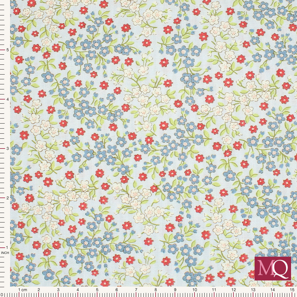 Cotton quilting fabric with delicate flowers in red, white and blue on light blue background