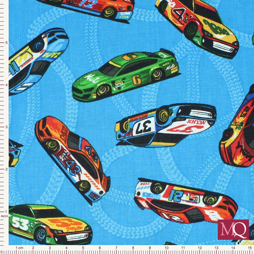 Cotton quilting fabric with racing cars on blue background