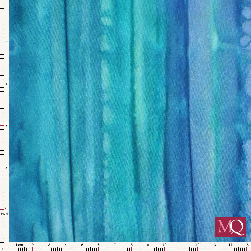 Cotton quilting fabric with tie dye effect in blue stripes