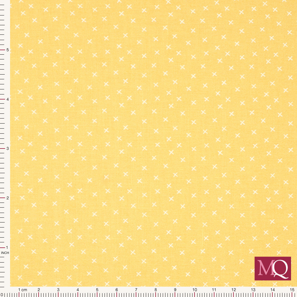 Cotton quilting fabric in a buttercup yellow with small white crosses in hand drawn style